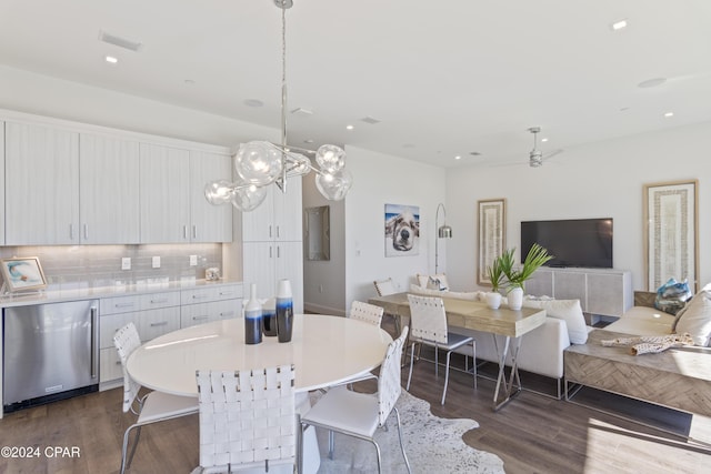 dining space with dark hardwood / wood-style flooring and ceiling fan