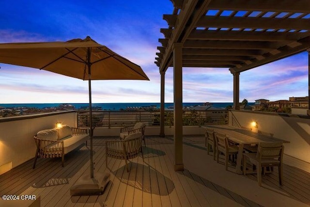 deck at dusk featuring an outdoor hangout area