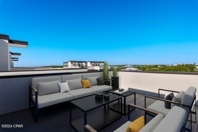 view of patio featuring an outdoor living space and a balcony