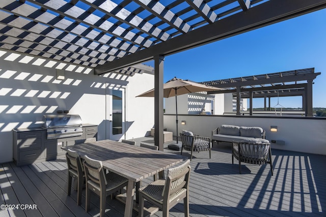 deck featuring an outdoor hangout area, exterior kitchen, a pergola, and grilling area