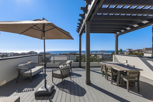 wooden deck with outdoor lounge area and a water view