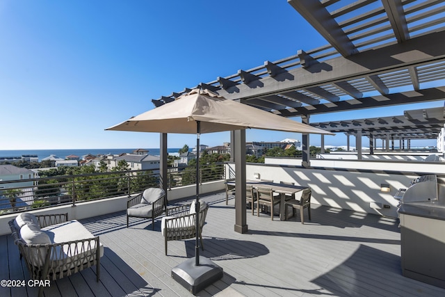 wooden deck with a pergola and a water view