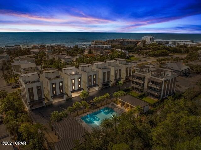 aerial view at dusk with a water view