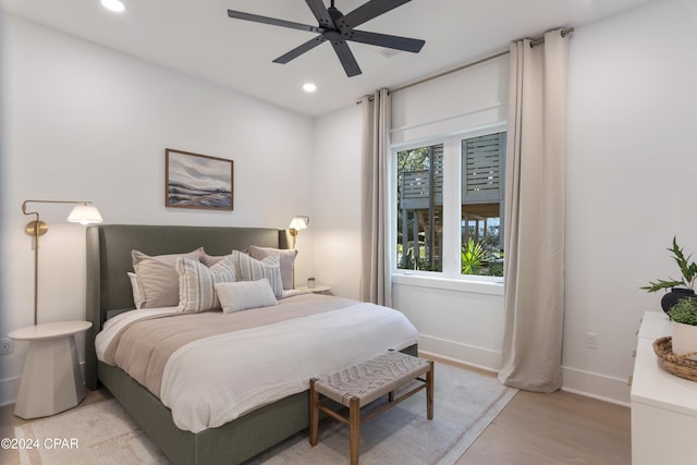 bedroom featuring light hardwood / wood-style flooring and ceiling fan