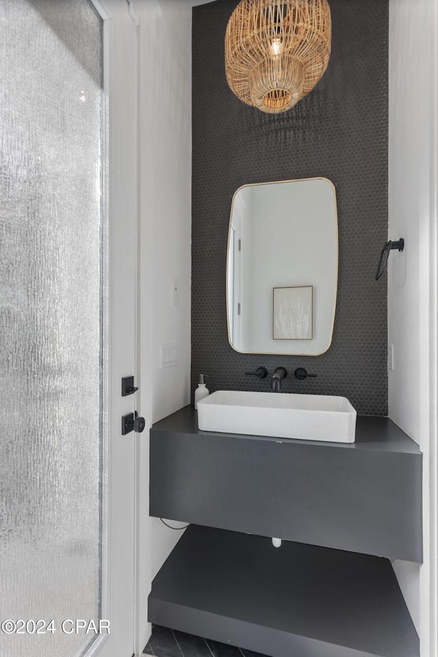 bathroom with sink and tile patterned flooring