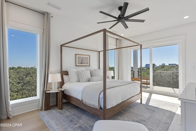 bedroom featuring access to outside, light hardwood / wood-style floors, and ceiling fan