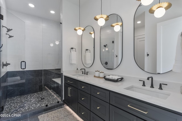 bathroom with tile patterned flooring, vanity, and an enclosed shower