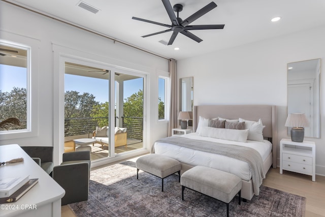 bedroom with access to exterior, wood-type flooring, and ceiling fan