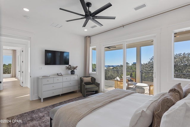 bedroom with ceiling fan, access to exterior, and light wood-type flooring