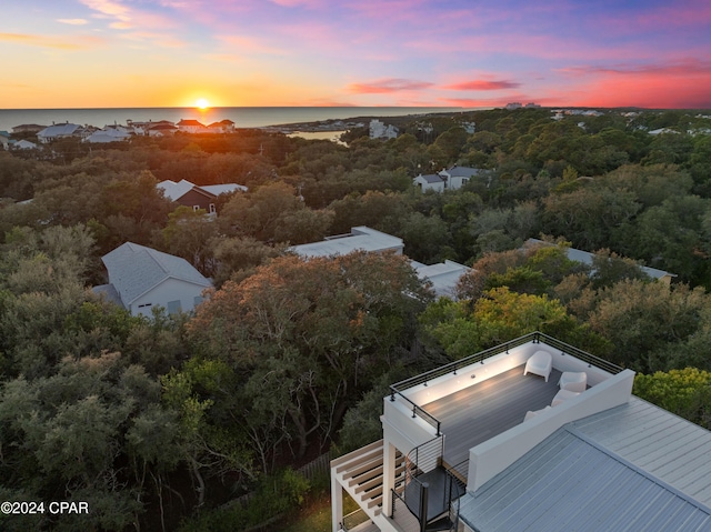 aerial view at dusk with a water view