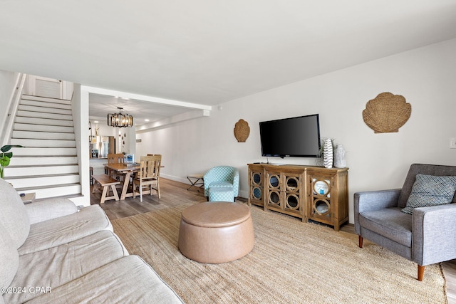 living room featuring a chandelier and hardwood / wood-style flooring