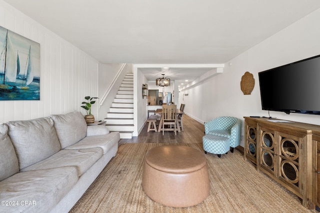 living room featuring a chandelier and hardwood / wood-style flooring