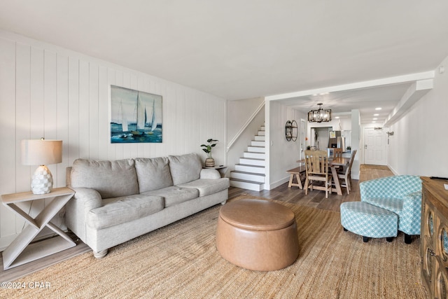 living room with a chandelier and wood-type flooring