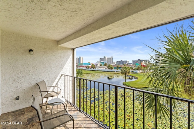 balcony featuring a water view