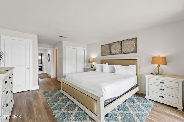 bedroom featuring a closet and hardwood / wood-style floors