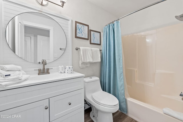 full bathroom featuring toilet, hardwood / wood-style floors, vanity, and shower / tub combo with curtain