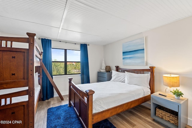 bedroom with hardwood / wood-style floors