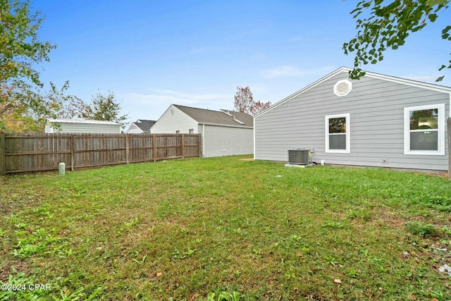 view of yard featuring central air condition unit