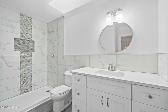 kitchen featuring decorative backsplash, white cabinets, and appliances with stainless steel finishes