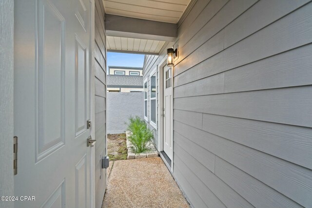 back of property featuring a lawn and a patio