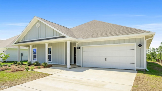 view of front of home with covered porch and a garage