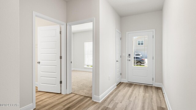 unfurnished bedroom featuring light colored carpet