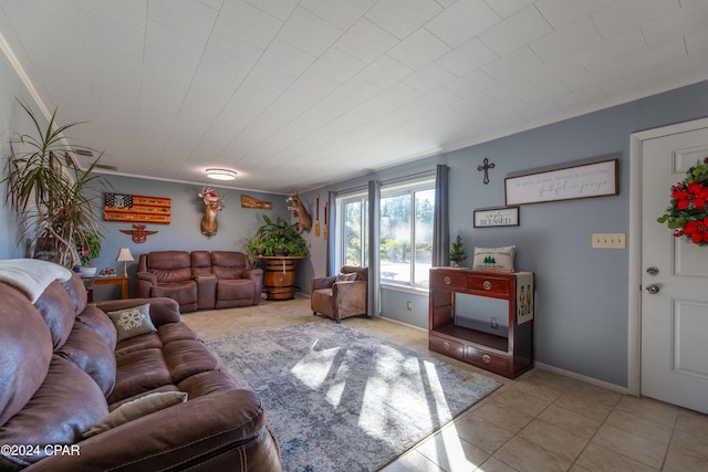 tiled living room featuring ornamental molding