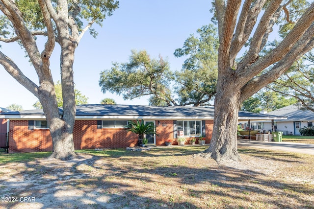 single story home with a carport