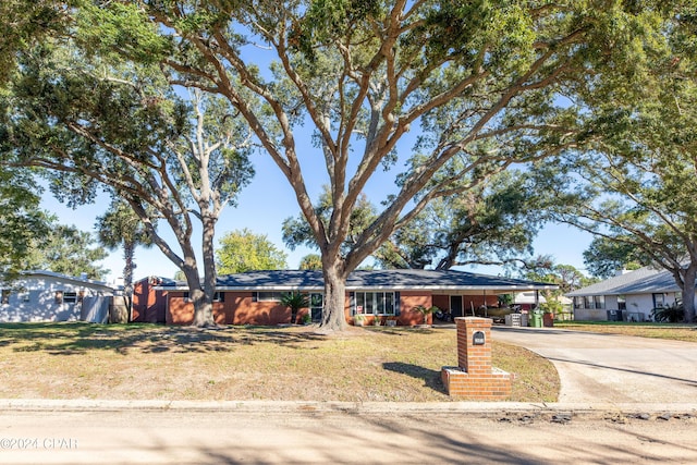 ranch-style house with a carport