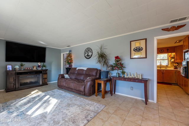 tiled living room featuring ornamental molding