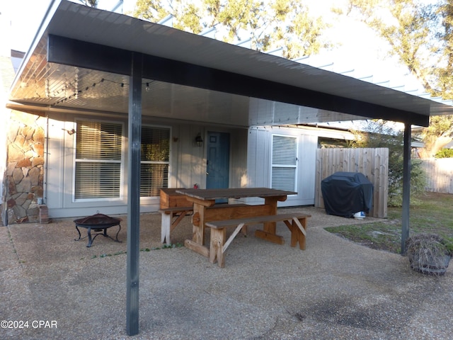 view of patio / terrace featuring area for grilling and a fire pit