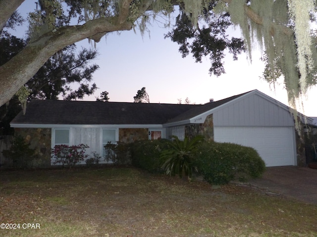 ranch-style home with a garage