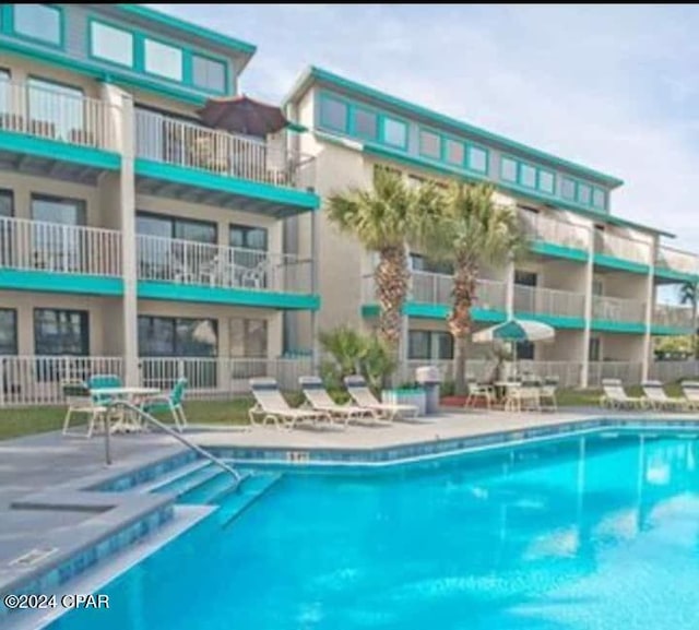 view of swimming pool featuring a patio area