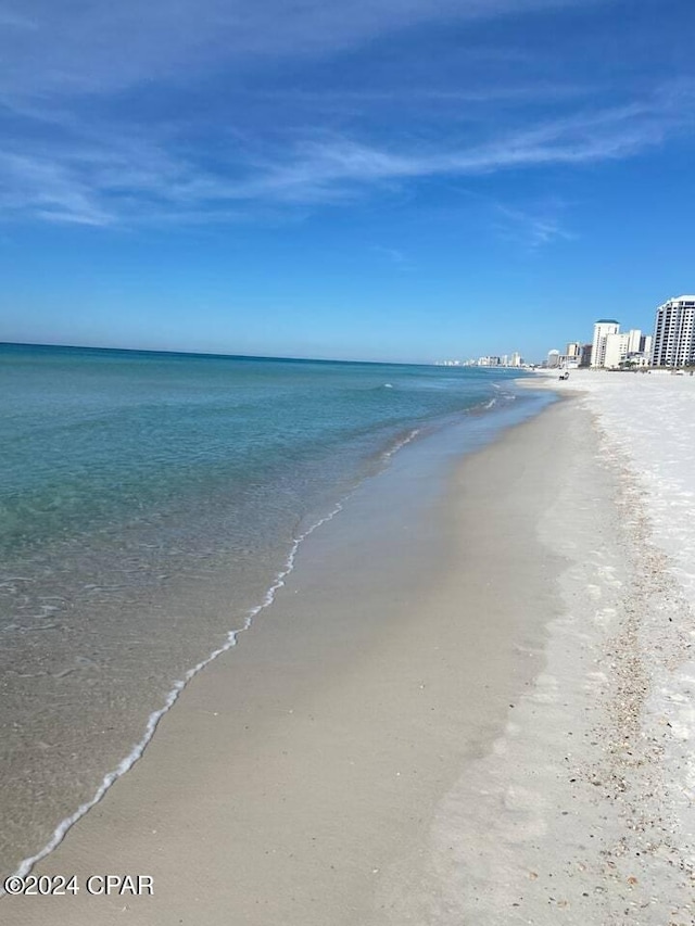 property view of water featuring a beach view