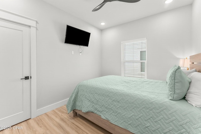 bedroom with recessed lighting, ceiling fan, baseboards, and wood finished floors