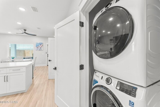 kitchen with light hardwood / wood-style flooring, white cabinets, stainless steel dishwasher, and sink