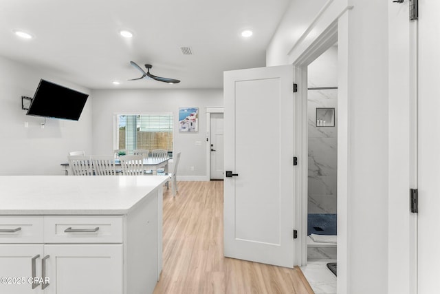 kitchen featuring recessed lighting, light countertops, visible vents, white cabinets, and ceiling fan