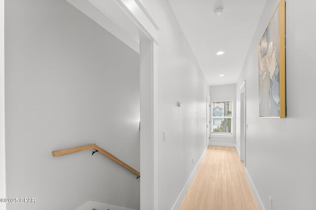 stairs featuring hardwood / wood-style floors