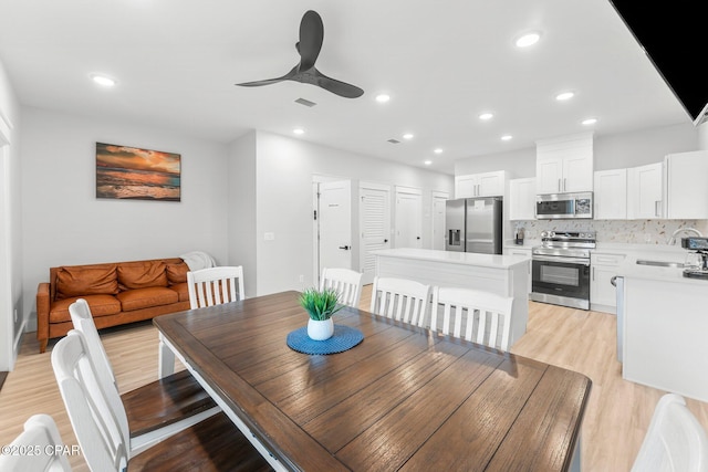 dining space featuring a ceiling fan, recessed lighting, visible vents, and light wood-style floors