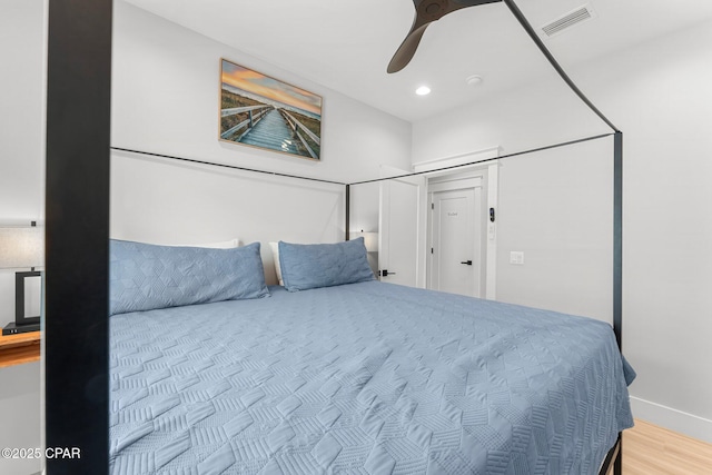 bedroom featuring recessed lighting, visible vents, ceiling fan, wood finished floors, and baseboards