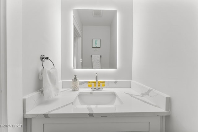 bathroom featuring visible vents and vanity