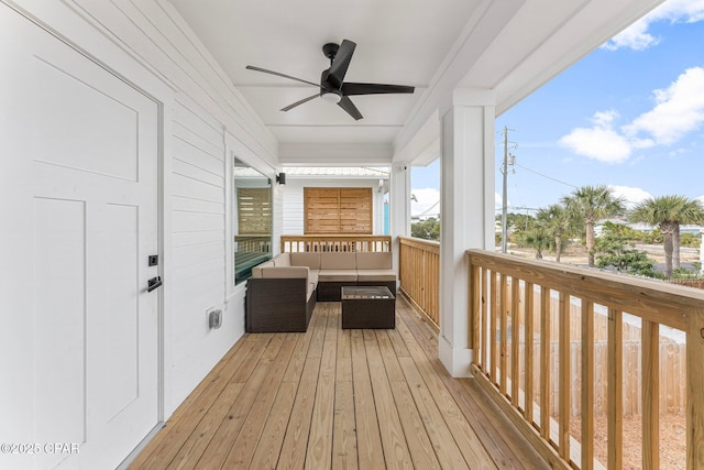 wooden terrace featuring ceiling fan and an outdoor hangout area