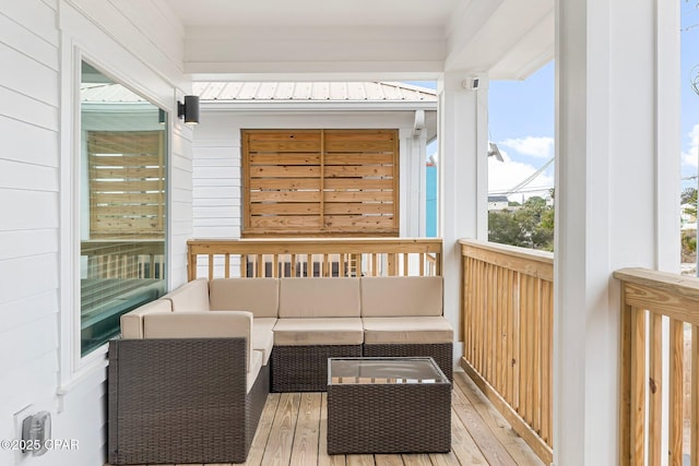 wooden terrace featuring an outdoor living space