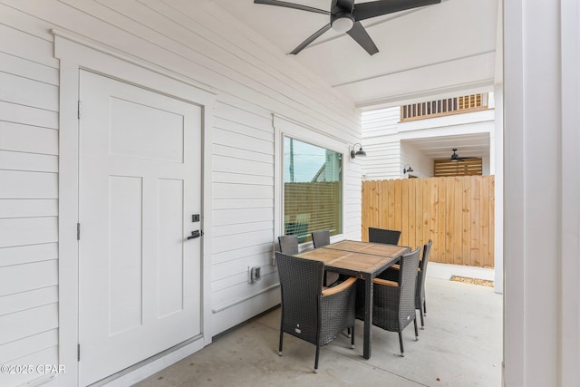 view of patio with outdoor dining space and ceiling fan