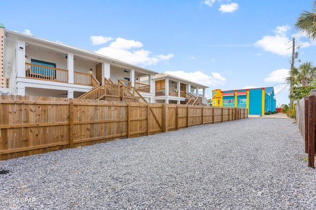 7026 Thomas Dr Unit A & B, Panama City Beach, FL 32408 - view of yard with ceiling fan and stairway