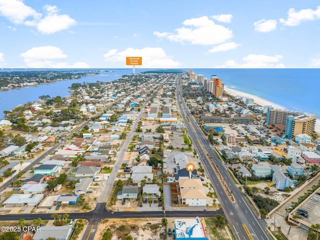 birds eye view of property with a water view and a city view