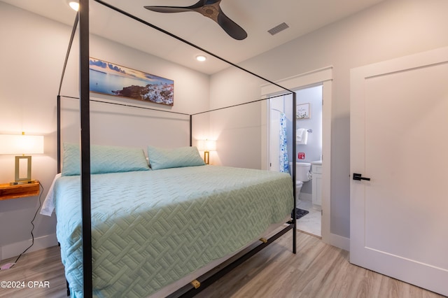 bedroom with hardwood / wood-style floors and ceiling fan