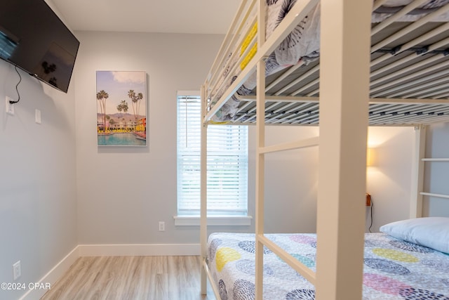 bedroom with light wood-type flooring