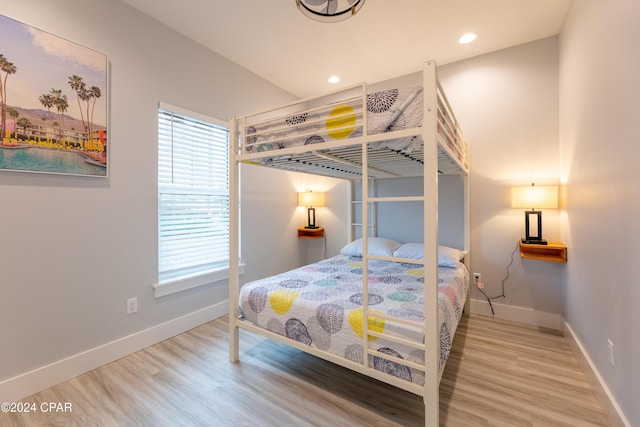 bedroom with hardwood / wood-style floors