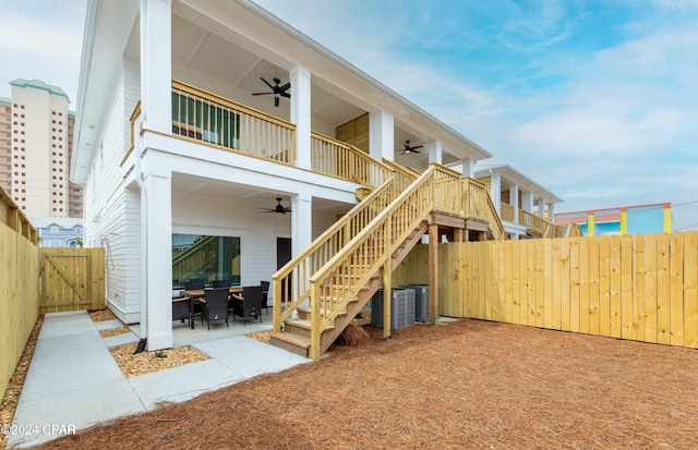 back of house featuring a patio, a balcony, and ceiling fan